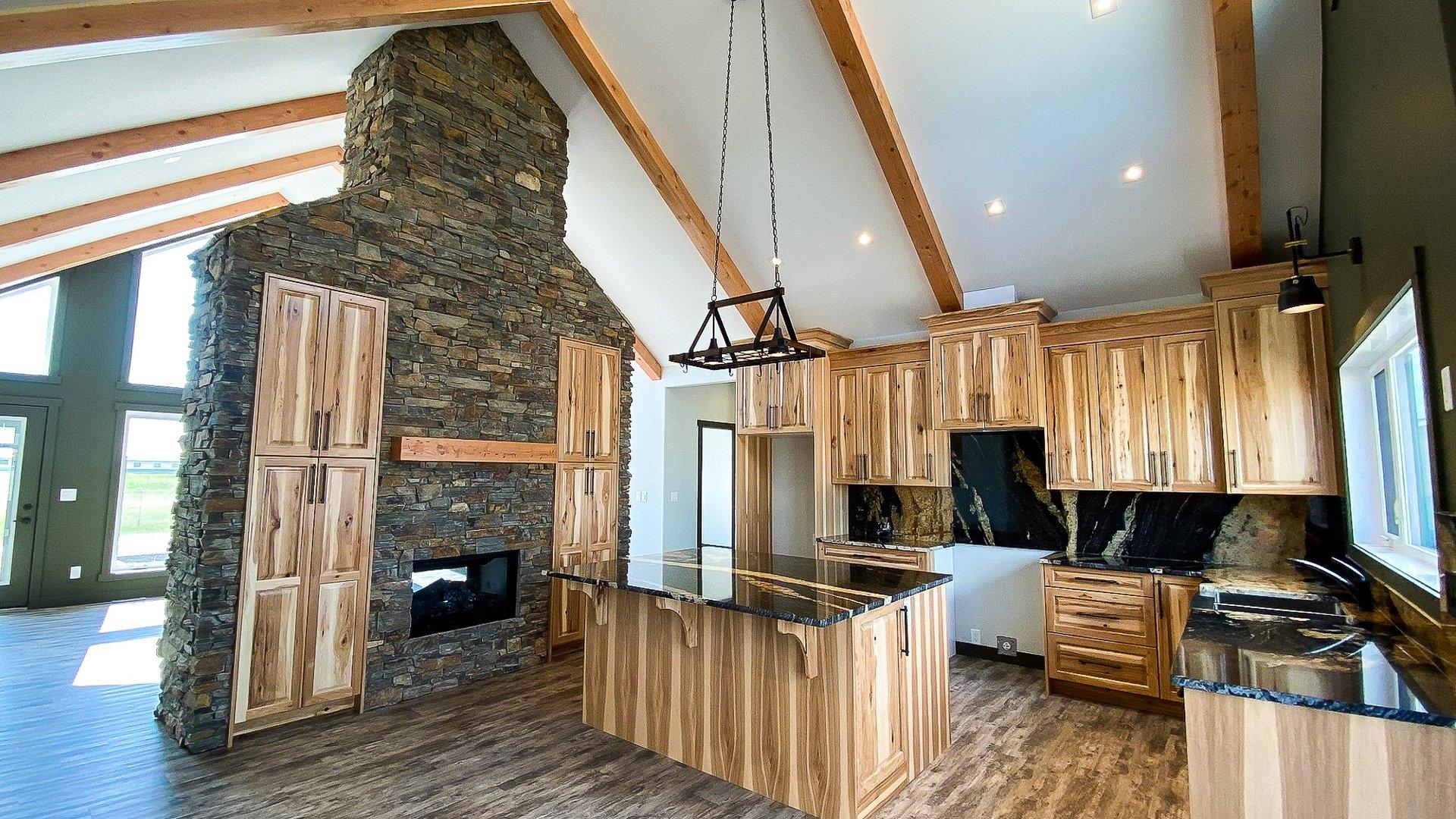 Valemount Kitchen, fireplace and beams.jpg